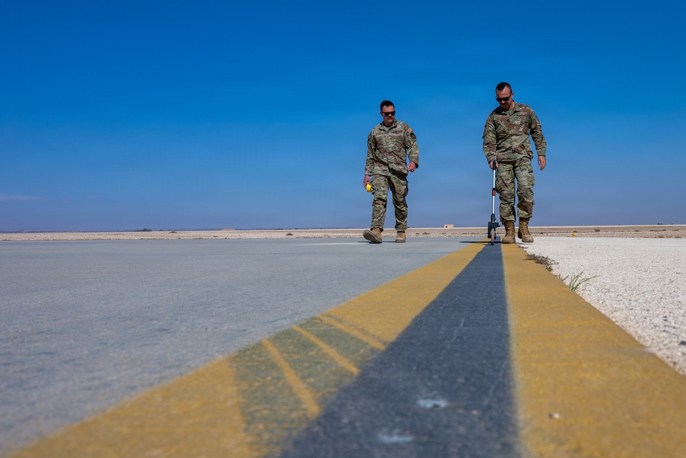 386th EOSS Airfield managers measure runway to ensure safe flight operations