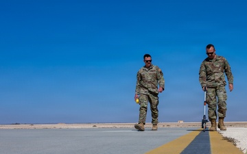 386th EOSS Airfield managers measure runway to ensure safe flight operations