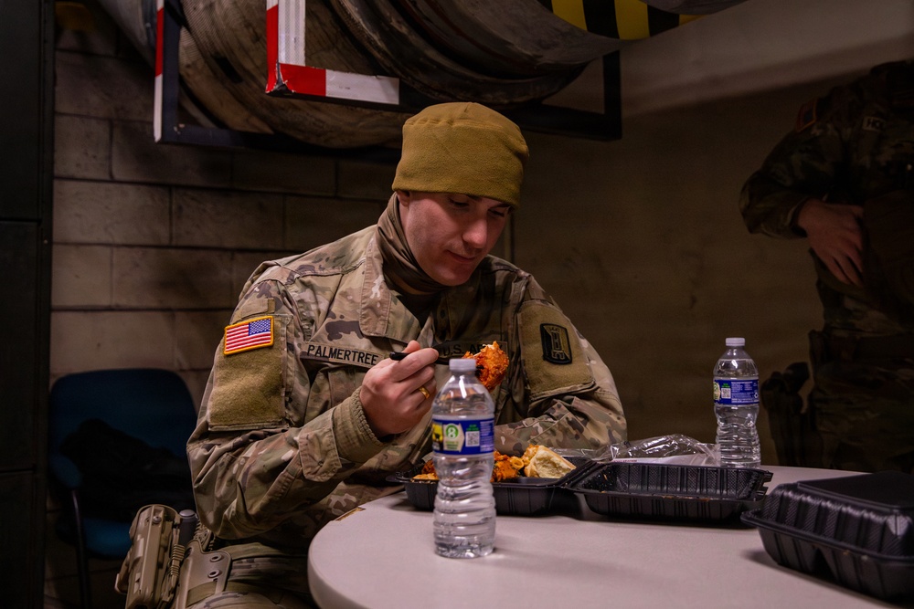 A Joint Task Force Magnolia Soldier eats while on patrol in Washington, D.C.