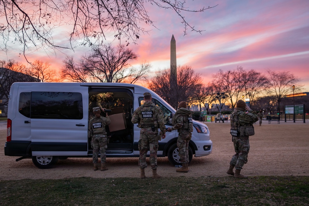 Joint Task Force Magnolia Soldiers receive food while on patrol on the National Mall