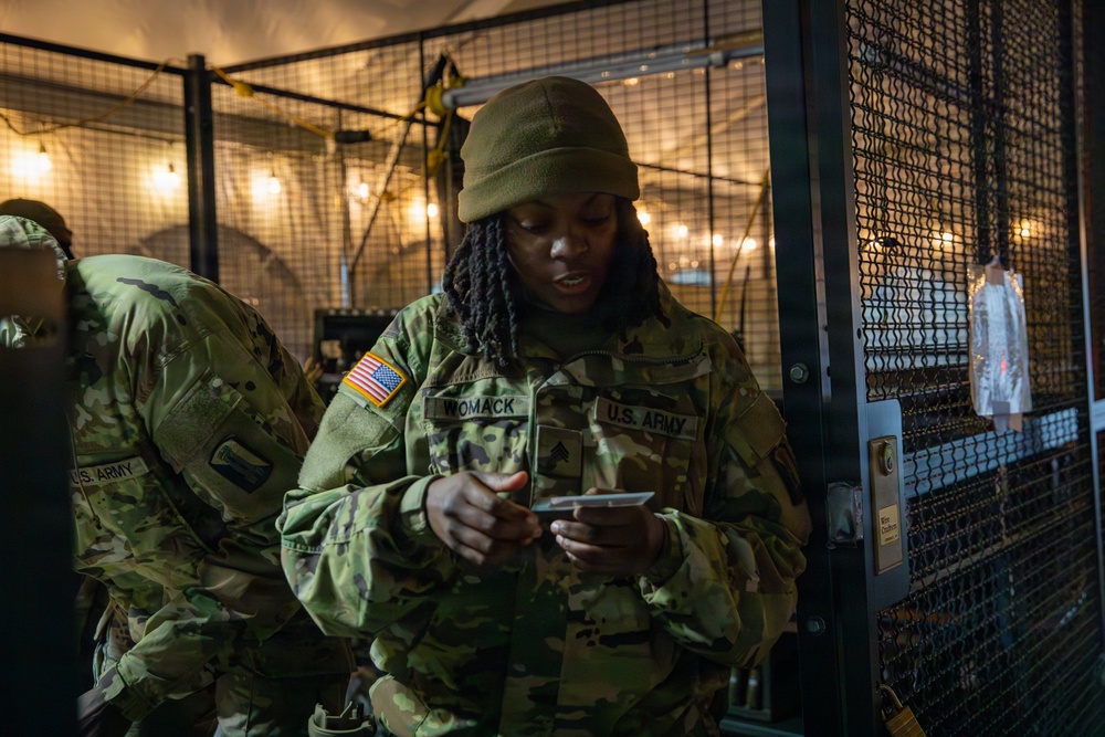 A Joint Task Force Magnolia Soldier reads an equipment receipt in Washington, D.C.