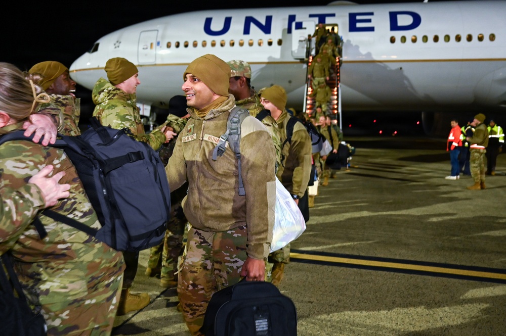 177th Fighter Wing unit members return to base after a more than three month deployment to Japan