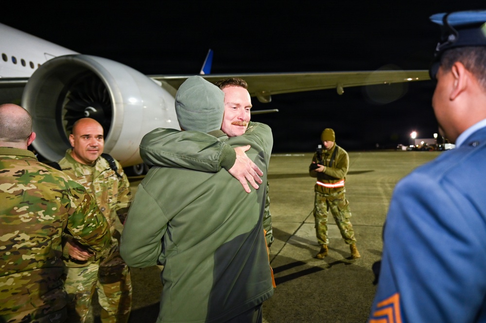 177th Fighter Wing unit members return to base after a more than three month deployment to Japan