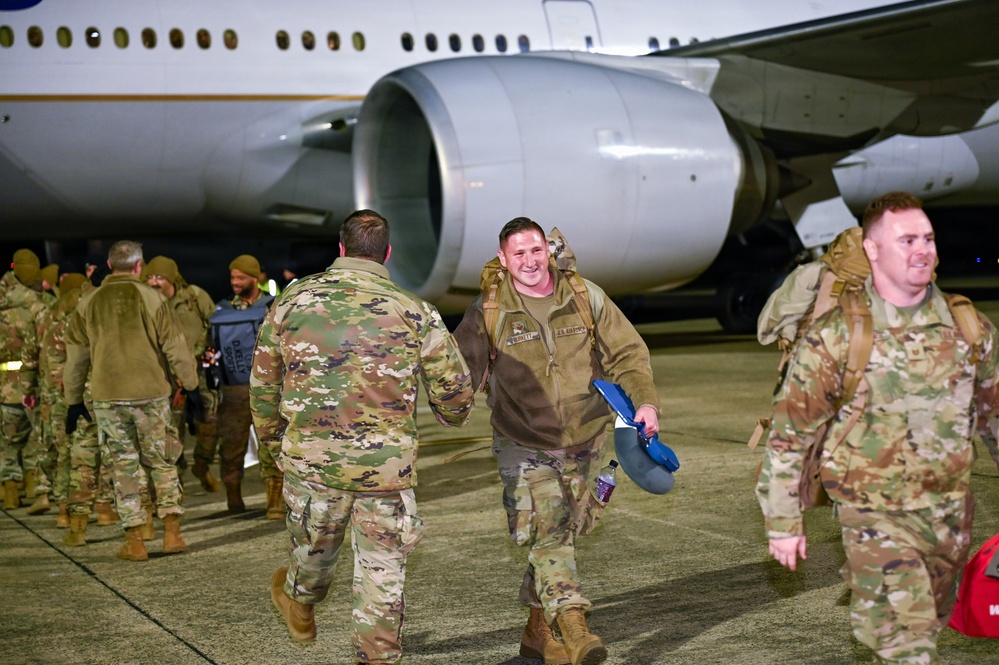 177th Fighter Wing unit members return to base after a more than three month deployment to Japan