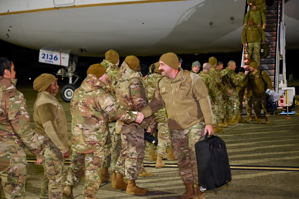 177th Fighter Wing unit members return to base after a more than three month deployment to Japan