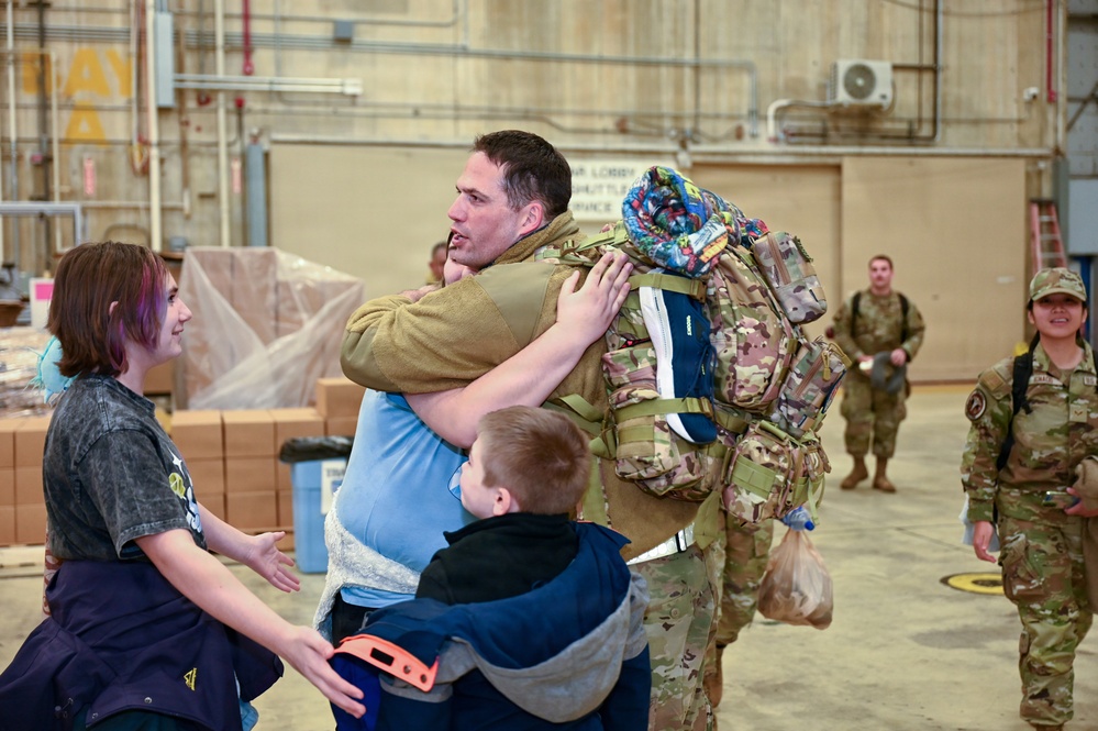 177th Fighter Wing unit members return to base after a more than three month deployment to Japan