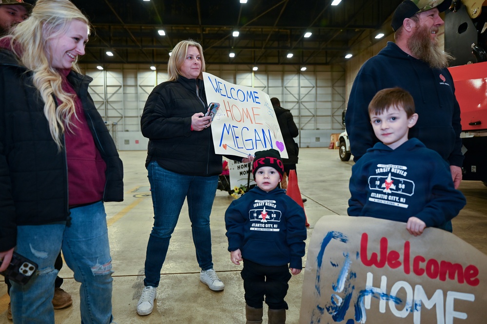 177th Fighter Wing unit members return to base after a more than three month deployment to Japan
