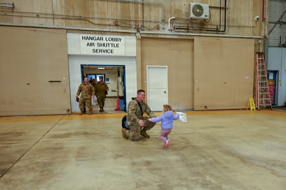 177th Fighter Wing unit members return to base after a more than three month deployment to Japan