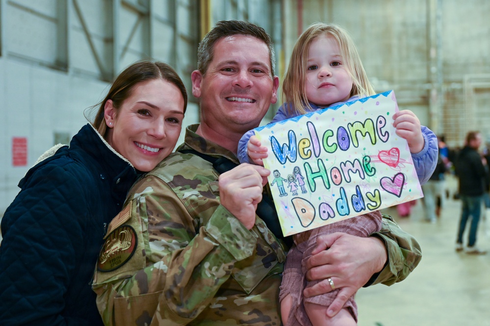 177th Fighter Wing unit members return to base after a more than three month deployment to Japan