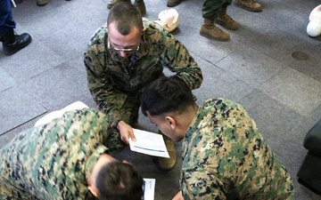 USCG Health Service Technicians provide first aid training to VMFA-225 Marines