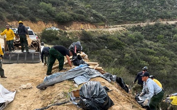 Forest Service personnel lead cleanup along Black Canyon Road