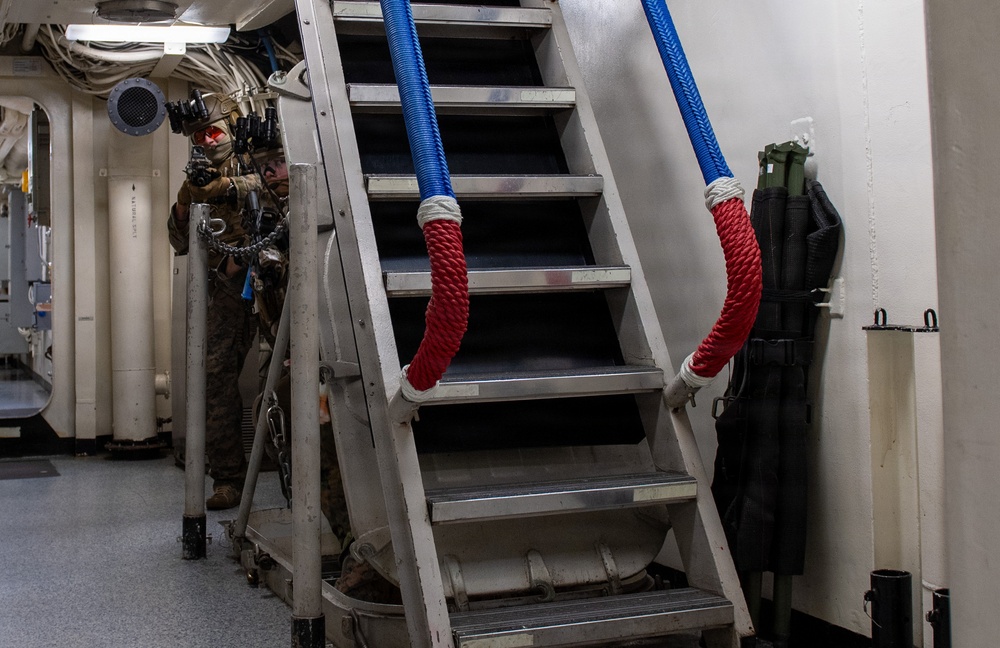U.S. Marines Peer into Passageway