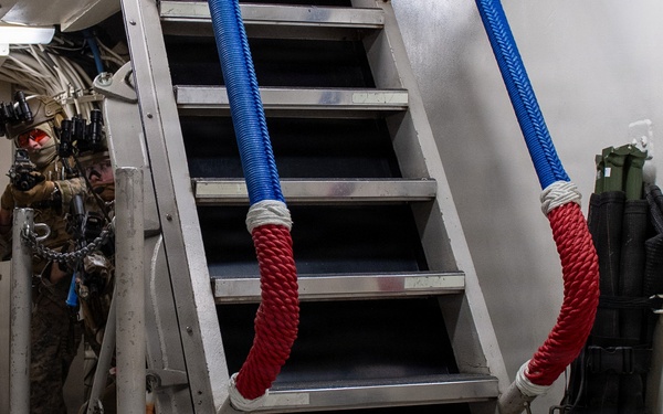 U.S. Marines Peer into Passageway