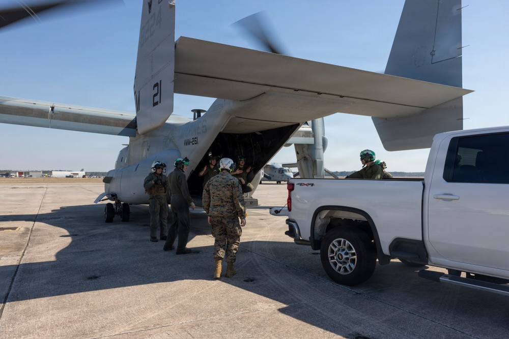 U.S. Marines with VMM-261 transport cargo