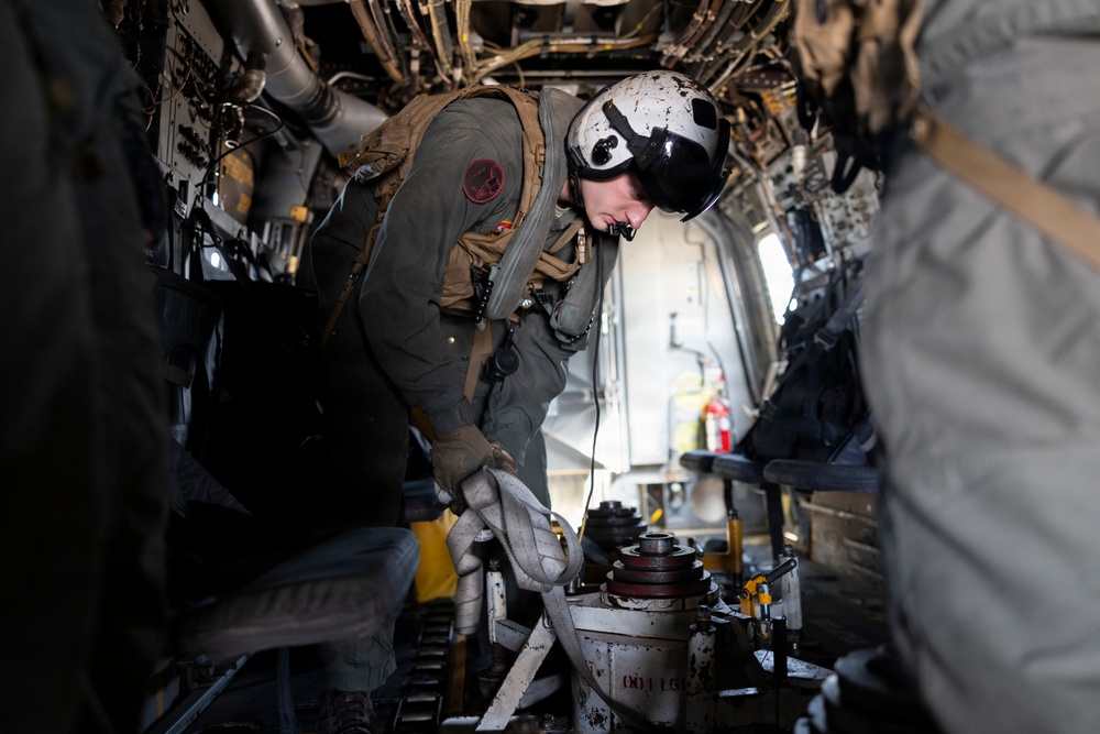 U.S. Marines with VMM-261 transport cargo
