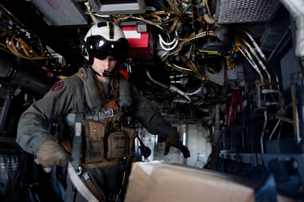 U.S. Marines with VMM-261 transport cargo