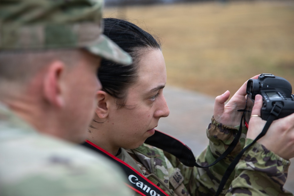 Sgt. Addison Shinn reviews Sgt. Alexandria Romanack's work