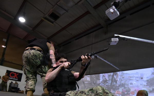 NSF Bahrain Sailors Train on Gun Range Simulator