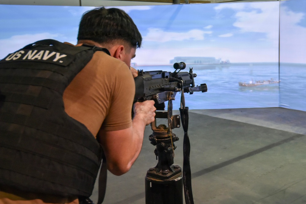 NSF Bahrain Sailors Train on Gun Range Simulator