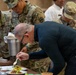 Chef Robert Irvine Reviews Dishes Prepared by 92G Soldiers