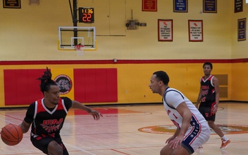 A member of team Fort Sam Houston defends the rim during the Capital Classic Basketball Tournament.