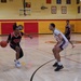 A member of team Fort Sam Houston defends the rim during the Capital Classic Basketball Tournament.