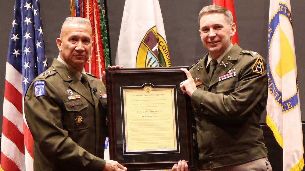 LTG Lozano presents certificate to COL Guy Yelverton III