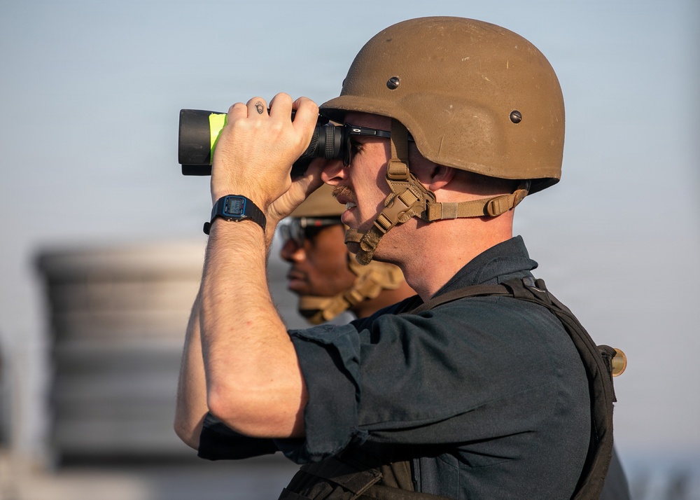 USS Mitscher (DDG 57) Sailor stands SCAT watch