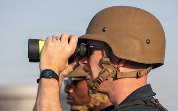 USS Mitscher (DDG 57) Sailor stands SCAT watch