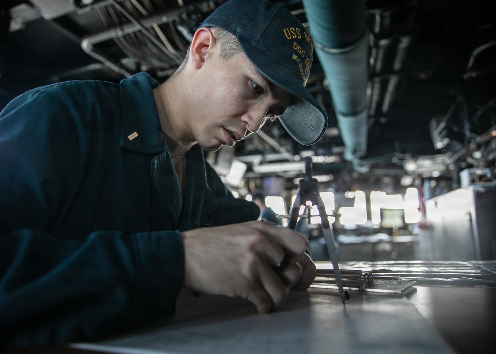 USS Mitscher (DDG 57) junior officer plots MOBOARD in ship bridge