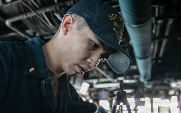 USS Mitscher (DDG 57) junior officer plots MOBOARD in ship bridge