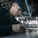 USS Mitscher (DDG 57) junior officer plots MOBOARD in ship bridge