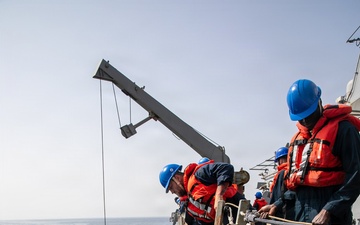 USS Mitscher (DDG 57) conducts small boat operations