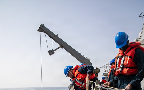 USS Mitscher (DDG 57) conducts small boat operations