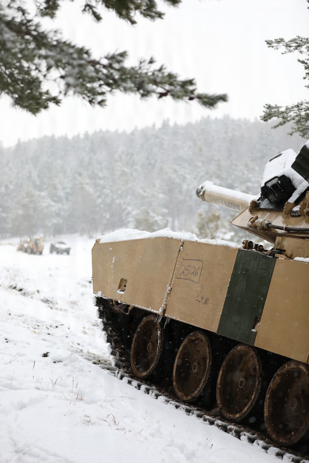 U.S. Army Tank Maintains Security Posture in the Woods During Combined Resolve 26-05 in Hohenfels, Germany