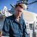 USS Mitscher (DDG 57) Sailor installs safety line on ship foc'sle