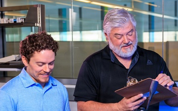 Industrial hygiene field service employees conduct study to measure fume hood safety for laboratory workers