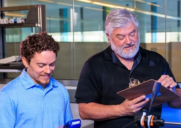 Industrial hygiene field service employees conduct study to measure fume hood safety for laboratory workers