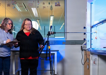 Industrial hygiene field service employees conduct study to measure fume hood safety for laboratory workers