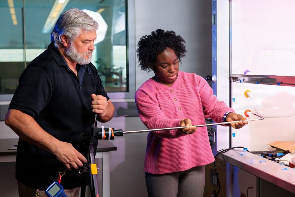 Industrial hygiene field service employees conduct study to measure fume hood safety for laboratory workers