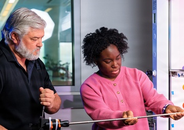 Industrial hygiene field service employees conduct study to measure fume hood safety for laboratory workers