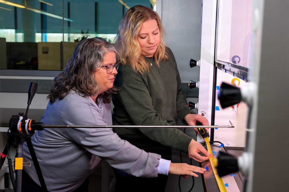 Industrial hygiene field service employees conduct study to measure fume hood safety for laboratory workers