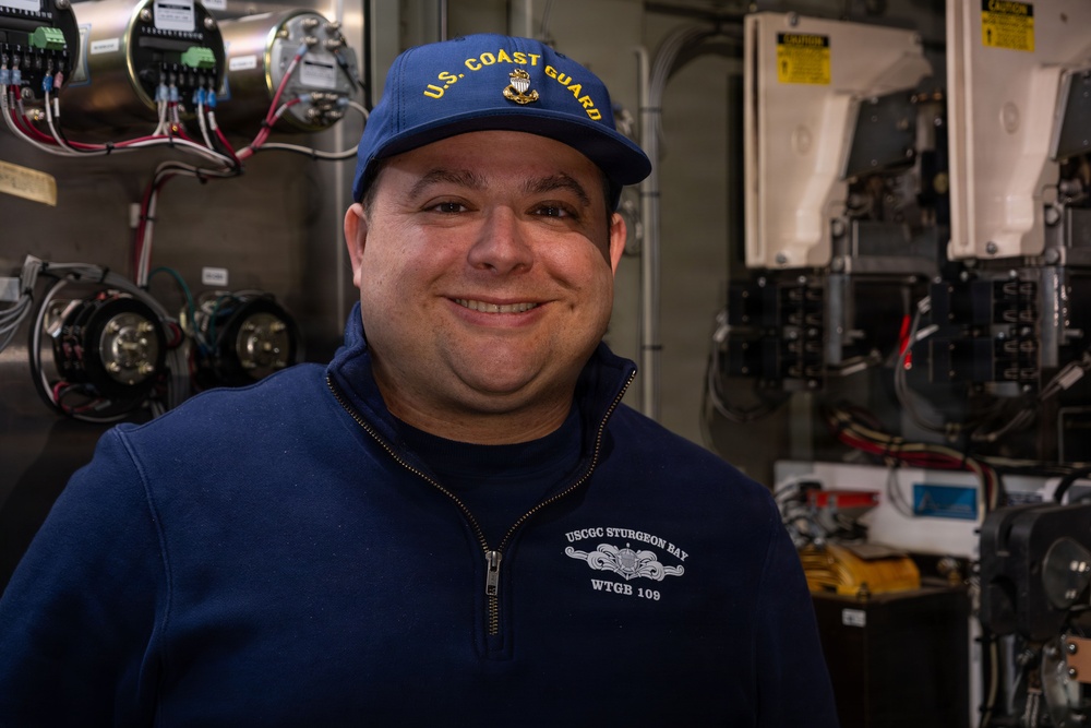 CGC Sturgeon Bay crew member poses for portrait following icebreaking operations