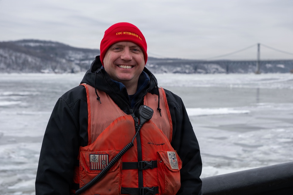 CGC Sturgeon Bay crew member poses for portrait following icebreaking operations