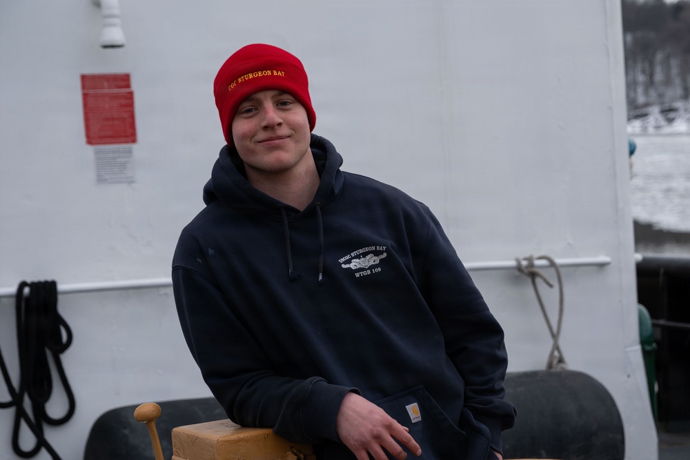 CGC Sturgeon Bay crew member poses for portrait following icebreaking operations