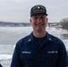 CGC Sturgeon Bay crew member poses for portrait following icebreaking operations