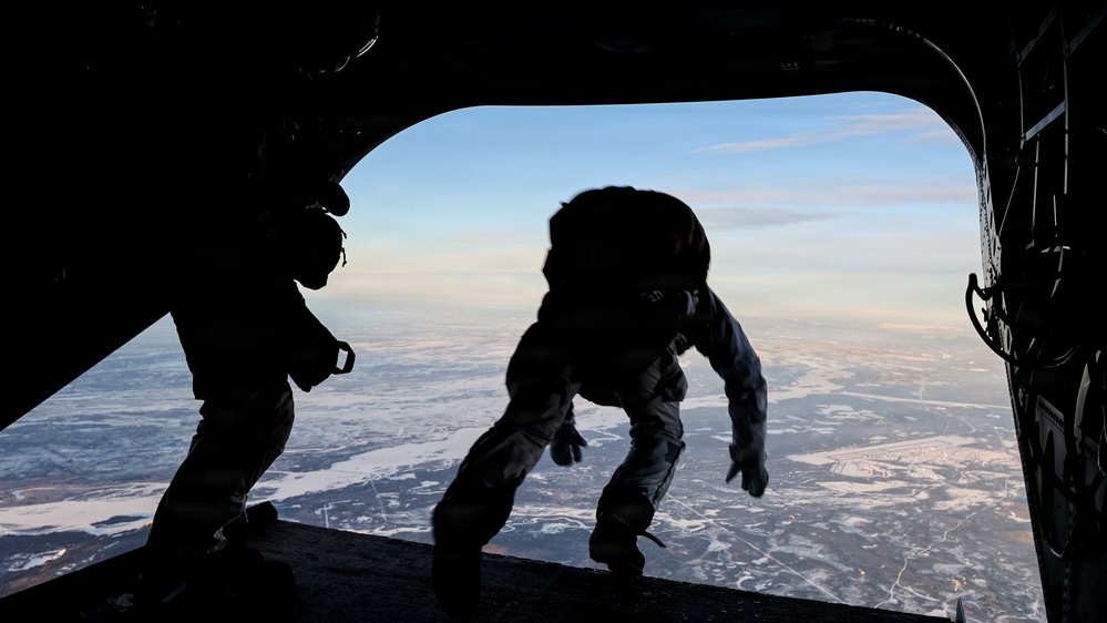 Green Beret exits CH-47 Chinook helicopter during a military free fall jump