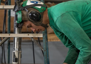 MH-60S Maintenance in USS Iwo Jima's Hangar Bay