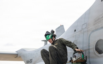 U.S. Marines with VMM-261 conduct maintenance on an MV-22B Osprey