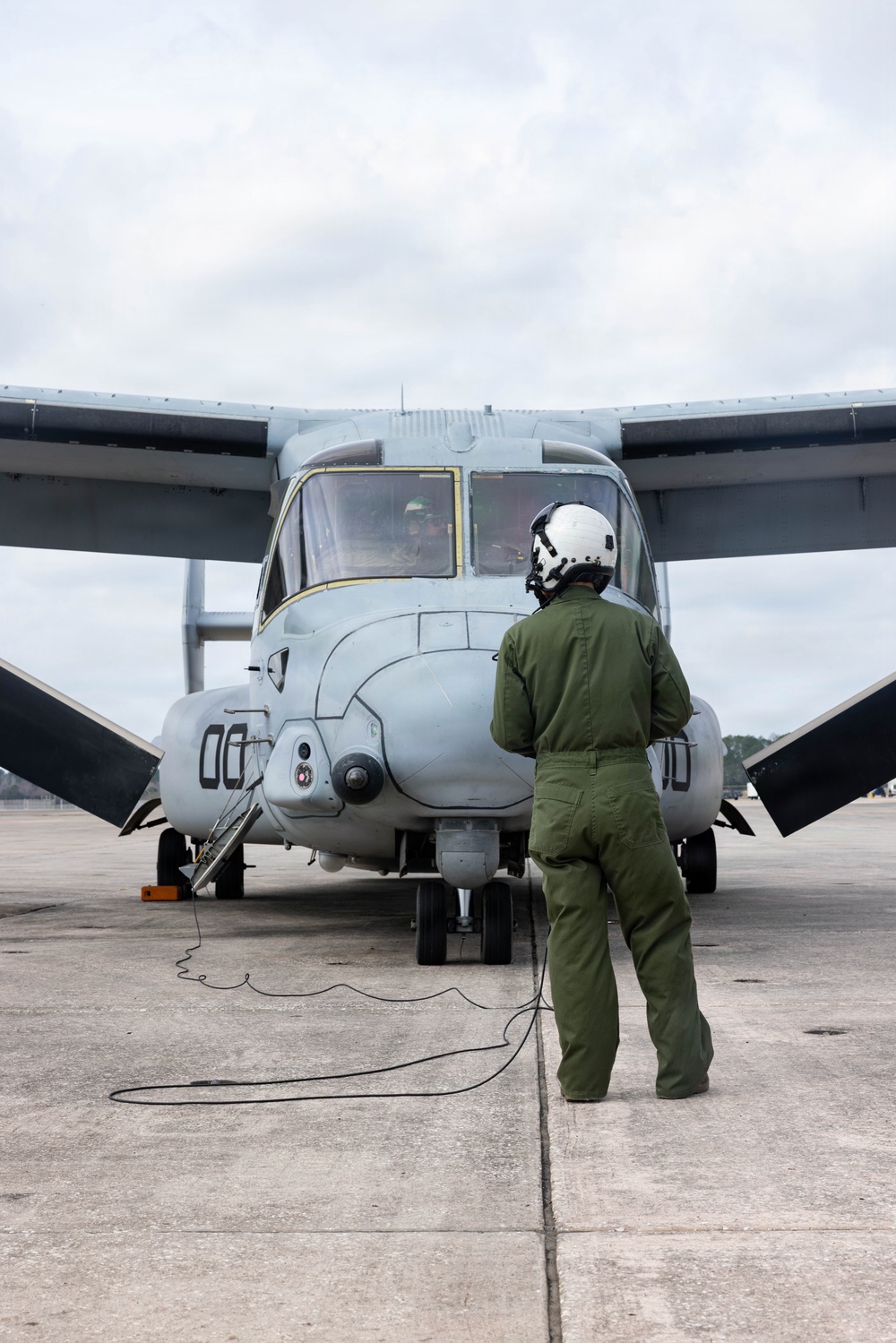 U.S. Marines with VMM-261 conduct maintenance on an MV-22B Osprey